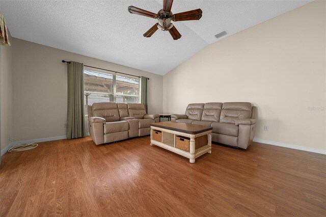 882 Tanglewood Pl, The Villages, FL 32162 - living area featuring visible vents, ceiling fan, a textured ceiling, wood finished floors, and lofted ceiling