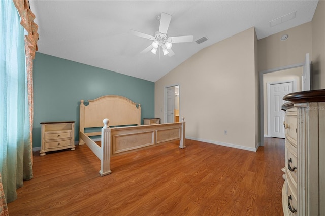 882 Tanglewood Pl, The Villages, FL 32162 - bedroom with a ceiling fan, visible vents, wood finished floors, lofted ceiling, and baseboards