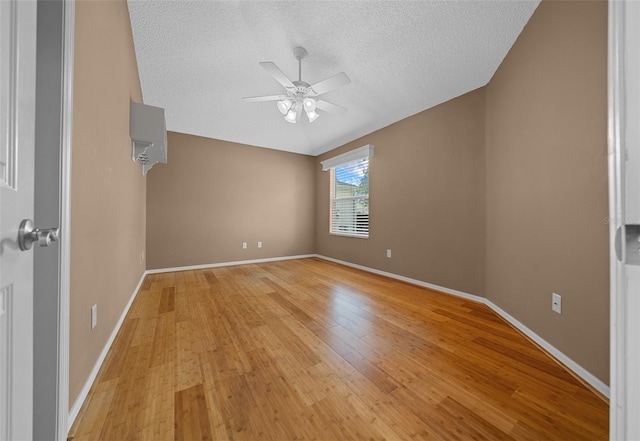 882 Tanglewood Pl, The Villages, FL 32162 - spare room featuring a textured ceiling, light wood finished floors, baseboards, and a ceiling fan