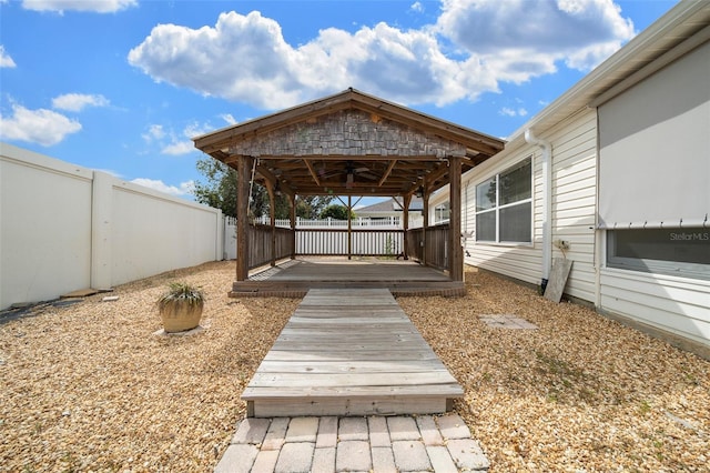 882 Tanglewood Pl, The Villages, FL 32162 - deck featuring a gazebo, ceiling fan, and a fenced backyard