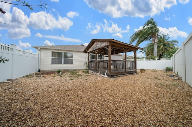 882 Tanglewood Pl, The Villages, FL 32162 - back of property featuring a gazebo and a fenced backyard