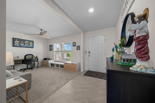 living room with light tile patterned floors, baseboards, and a ceiling fan