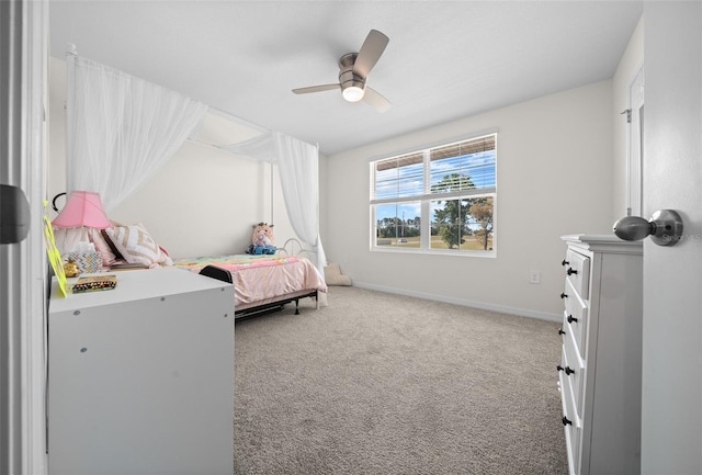 carpeted bedroom with baseboards and a ceiling fan