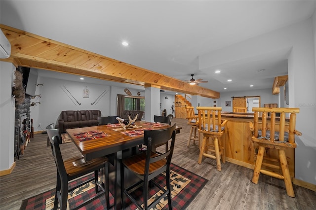dining room featuring indoor bar, recessed lighting, and wood finished floors