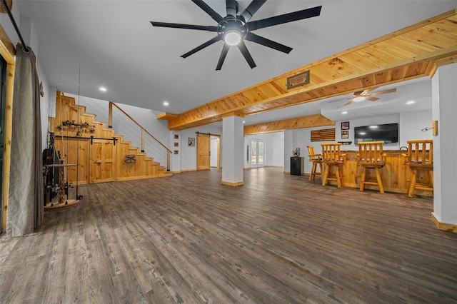 living area with stairway, baseboards, a ceiling fan, and wood finished floors