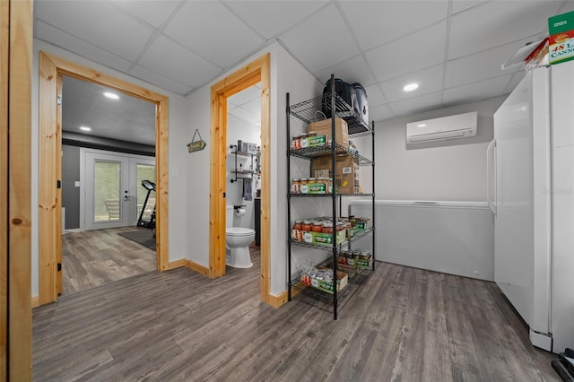 storage room featuring an AC wall unit