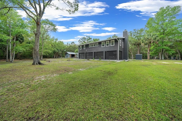 view of yard featuring an attached garage