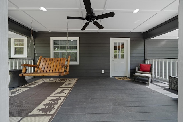 wooden terrace featuring ceiling fan