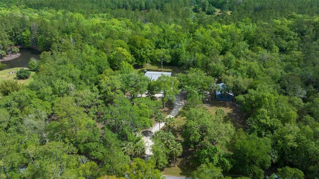 bird's eye view featuring a wooded view