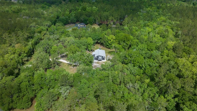 drone / aerial view featuring a forest view