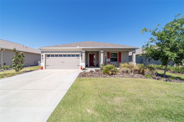 single story home with an attached garage, concrete driveway, a front yard, and stucco siding
