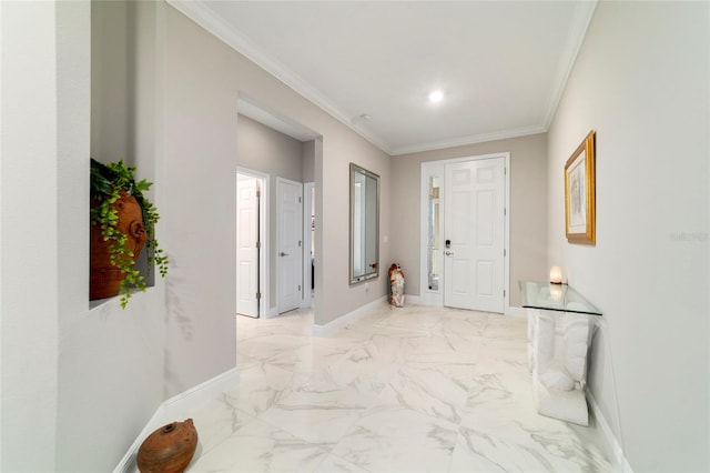 hallway featuring baseboards and crown molding