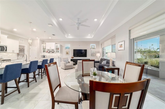 dining area with marble finish floor, a ceiling fan, crown molding, and recessed lighting