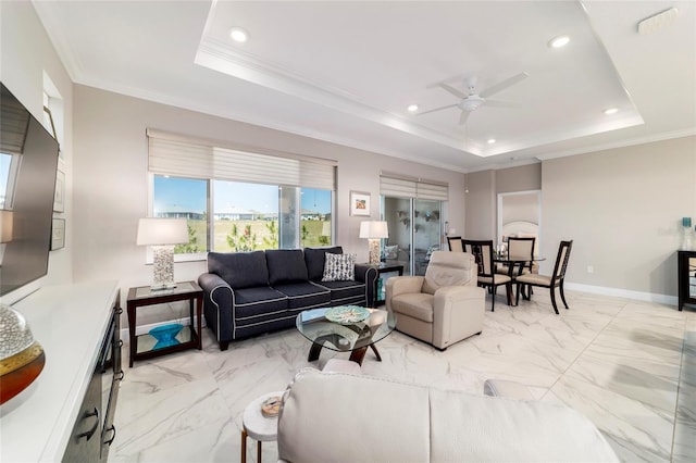 living room featuring recessed lighting, marble finish floor, ceiling fan, crown molding, and a raised ceiling