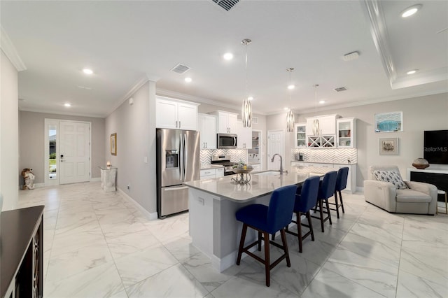 kitchen with a kitchen breakfast bar, marble finish floor, appliances with stainless steel finishes, visible vents, and recessed lighting