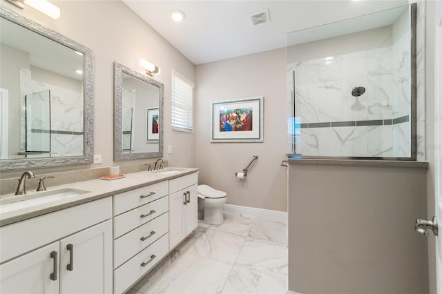 full bathroom featuring visible vents, marble finish floor, a marble finish shower, and a sink