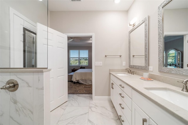 bathroom with walk in shower, marble finish floor, and a sink