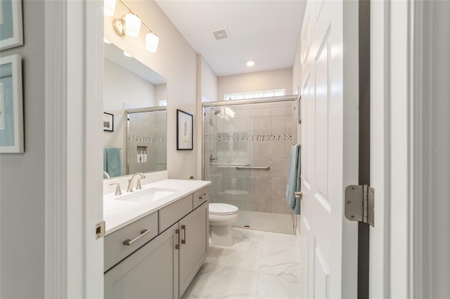 full bathroom with vanity, visible vents, a shower stall, and toilet