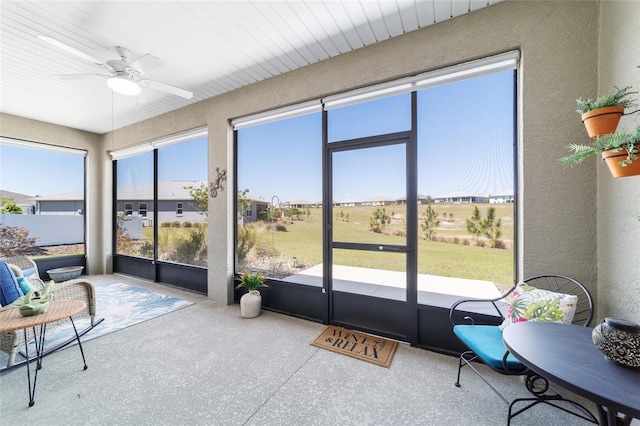 sunroom with a ceiling fan