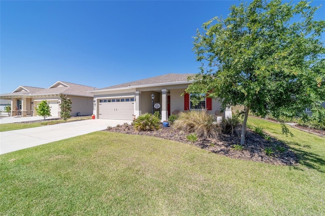 single story home featuring a garage, driveway, a front lawn, and stucco siding