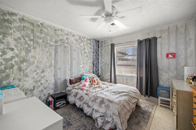 bedroom with speckled floor, a ceiling fan, and a textured ceiling
