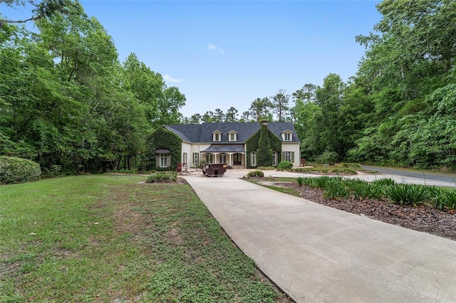 1251 SW 43rd Pl, Ocala, FL 34471 - french country style house with driveway and a front lawn