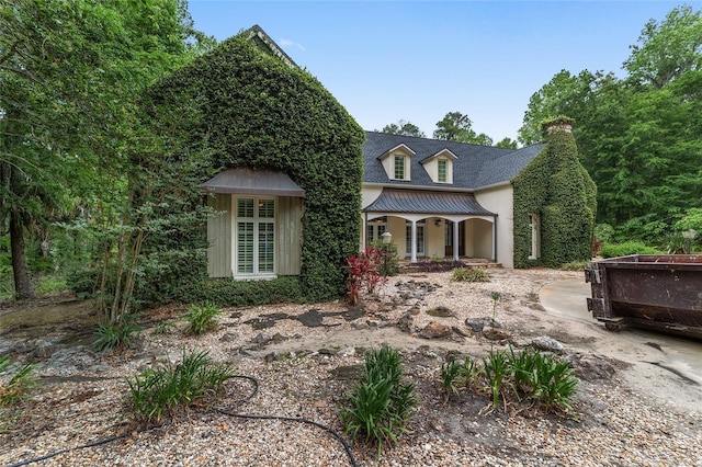 1251 SW 43rd Pl, Ocala, FL 34471 - view of front of house featuring covered porch and a chimney