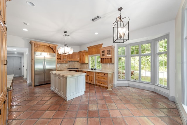 1251 SW 43rd Pl, Ocala, FL 34471 - kitchen featuring stainless steel built in refrigerator, a chandelier, light countertops, tasteful backsplash, and recessed lighting