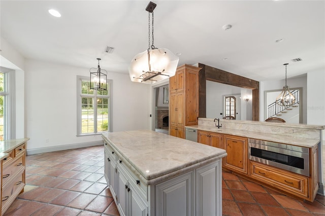 1251 SW 43rd Pl, Ocala, FL 34471 - kitchen featuring a chandelier, dishwasher, oven, a sink, and a center island