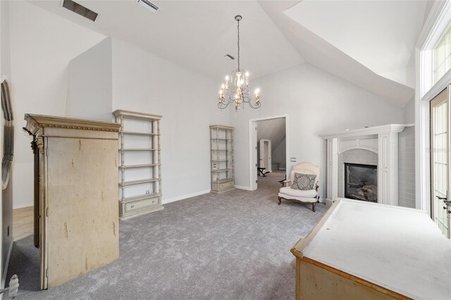 1251 SW 43rd Pl, Ocala, FL 34471 - living area featuring carpet floors, a chandelier, a fireplace, high vaulted ceiling, and baseboards