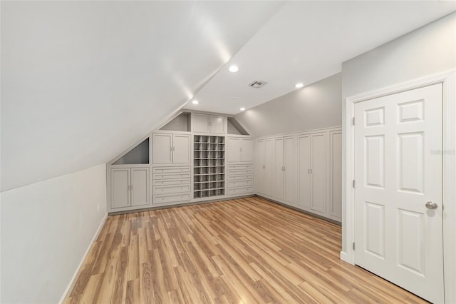 1251 SW 43rd Pl, Ocala, FL 34471 - additional living space with lofted ceiling, light wood finished floors, recessed lighting, and baseboards