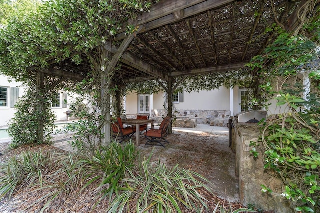 1251 SW 43rd Pl, Ocala, FL 34471 - view of patio featuring a pergola and an outdoor kitchen