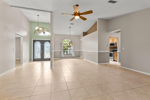 entryway featuring baseboards, french doors, light tile patterned flooring, visible vents, and ceiling fan with notable chandelier