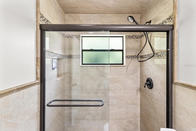 full bath with a shower stall