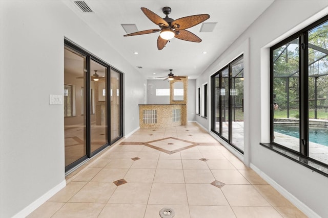 unfurnished sunroom featuring visible vents
