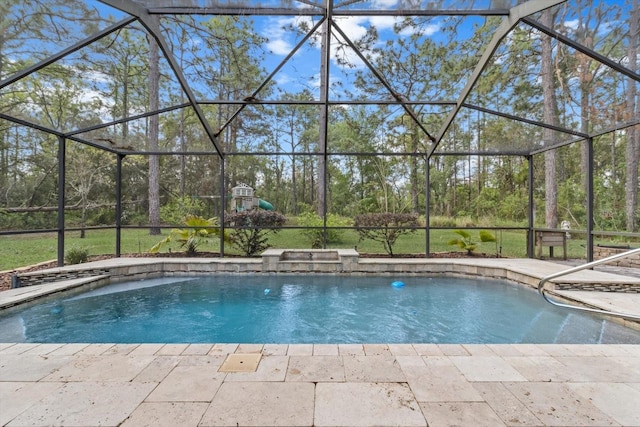 pool with a patio area and a lanai