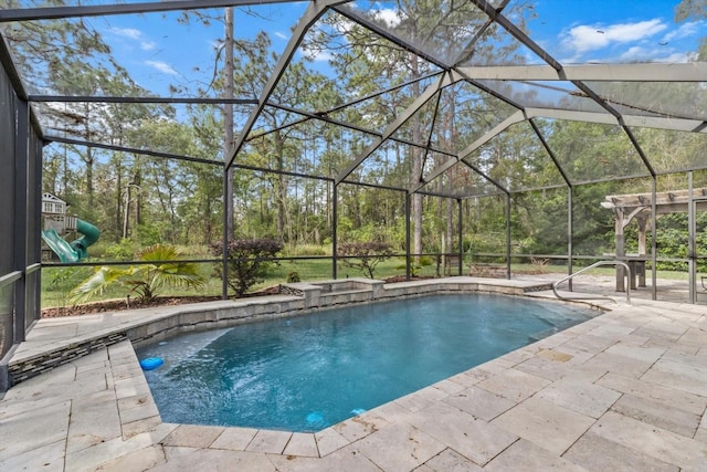 pool with a patio and glass enclosure