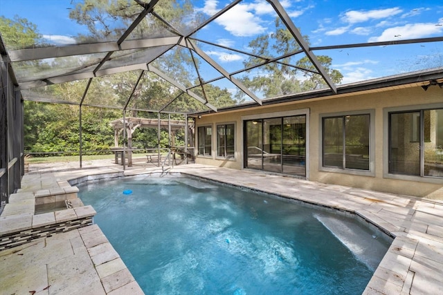 outdoor pool with a patio area and glass enclosure