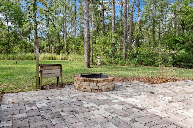 view of patio featuring a fire pit