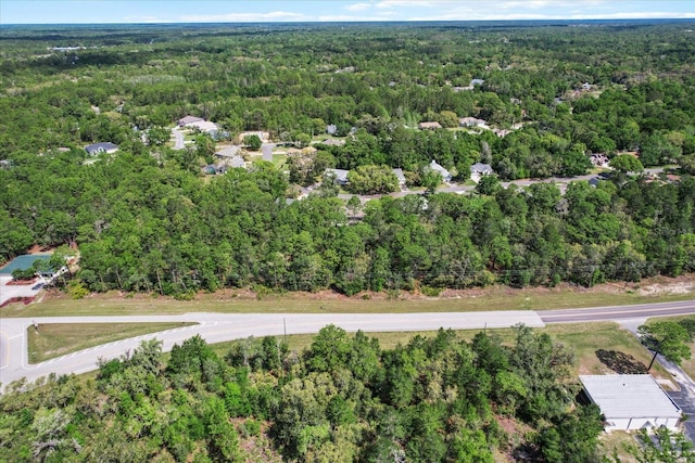 aerial view featuring a view of trees