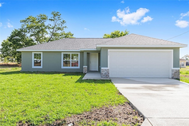 ranch-style house with a front yard, an attached garage, driveway, and stone siding