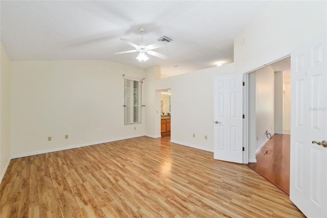 spare room with light wood-style floors, ceiling fan, baseboards, and visible vents