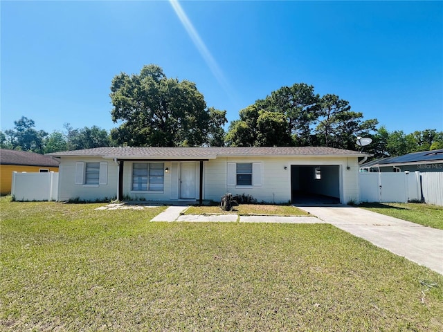 ranch-style home with concrete driveway, a garage, a front yard, and fence
