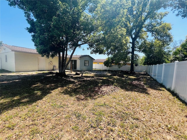 view of yard with a fenced backyard