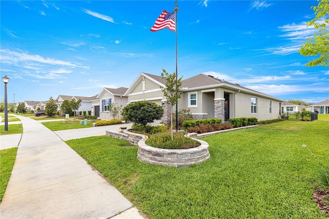 5220 Sunshine Dr, Wildwood, FL 34785 - view of front facade featuring a residential view, stucco siding, driveway, stone siding, and a front lawn