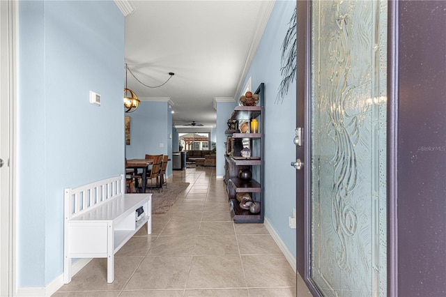 5220 Sunshine Dr, Wildwood, FL 34785 - hall featuring a notable chandelier, baseboards, crown molding, and light tile patterned flooring