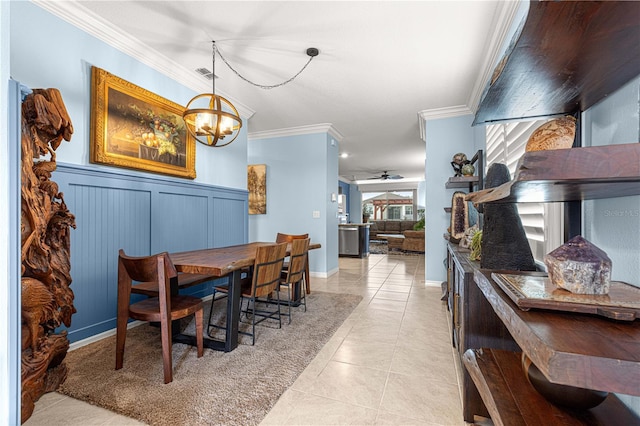 5220 Sunshine Dr, Wildwood, FL 34785 - dining area with light tile patterned floors, visible vents, ceiling fan with notable chandelier, and crown molding