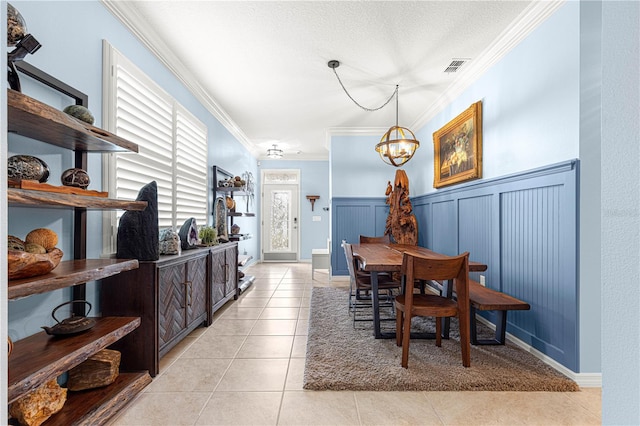 5220 Sunshine Dr, Wildwood, FL 34785 - dining area with a chandelier, crown molding, light tile patterned floors, and visible vents