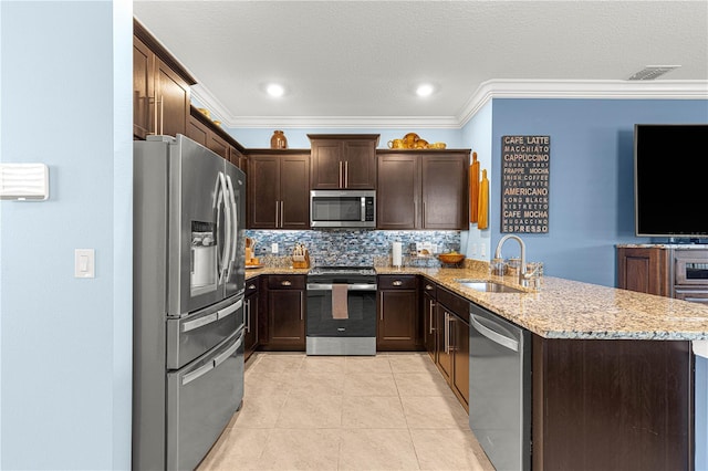 5220 Sunshine Dr, Wildwood, FL 34785 - kitchen with a sink, crown molding, and stainless steel appliances