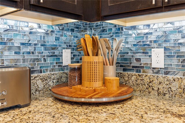 5220 Sunshine Dr, Wildwood, FL 34785 - room details featuring dark brown cabinets and backsplash